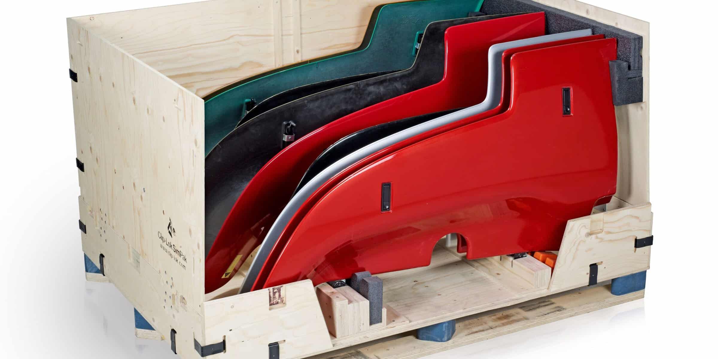 Clip-Lok branded plywood crate with custom dunnage holding automotive body panels for export